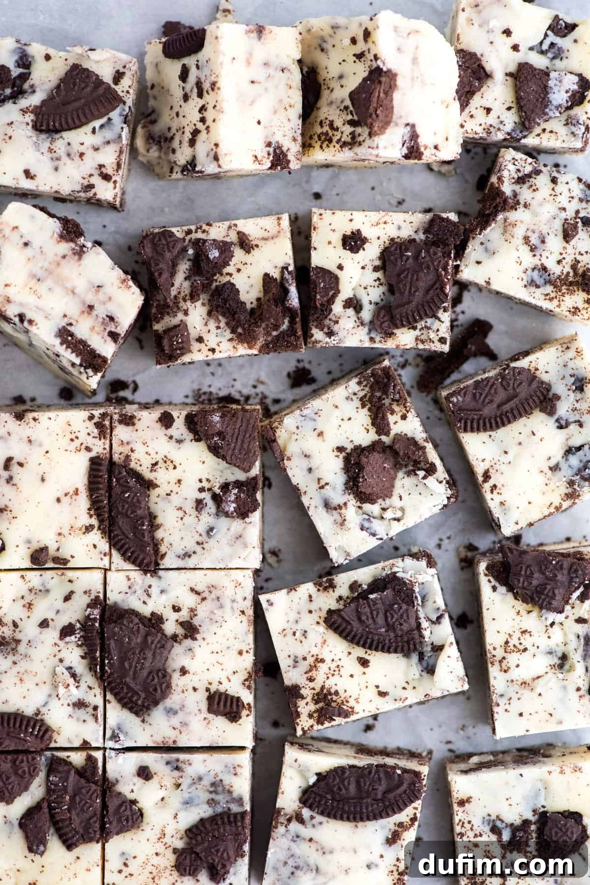 Multiple delicious slices of Oreo fudge arranged neatly in a grid, showcasing its irresistible texture.