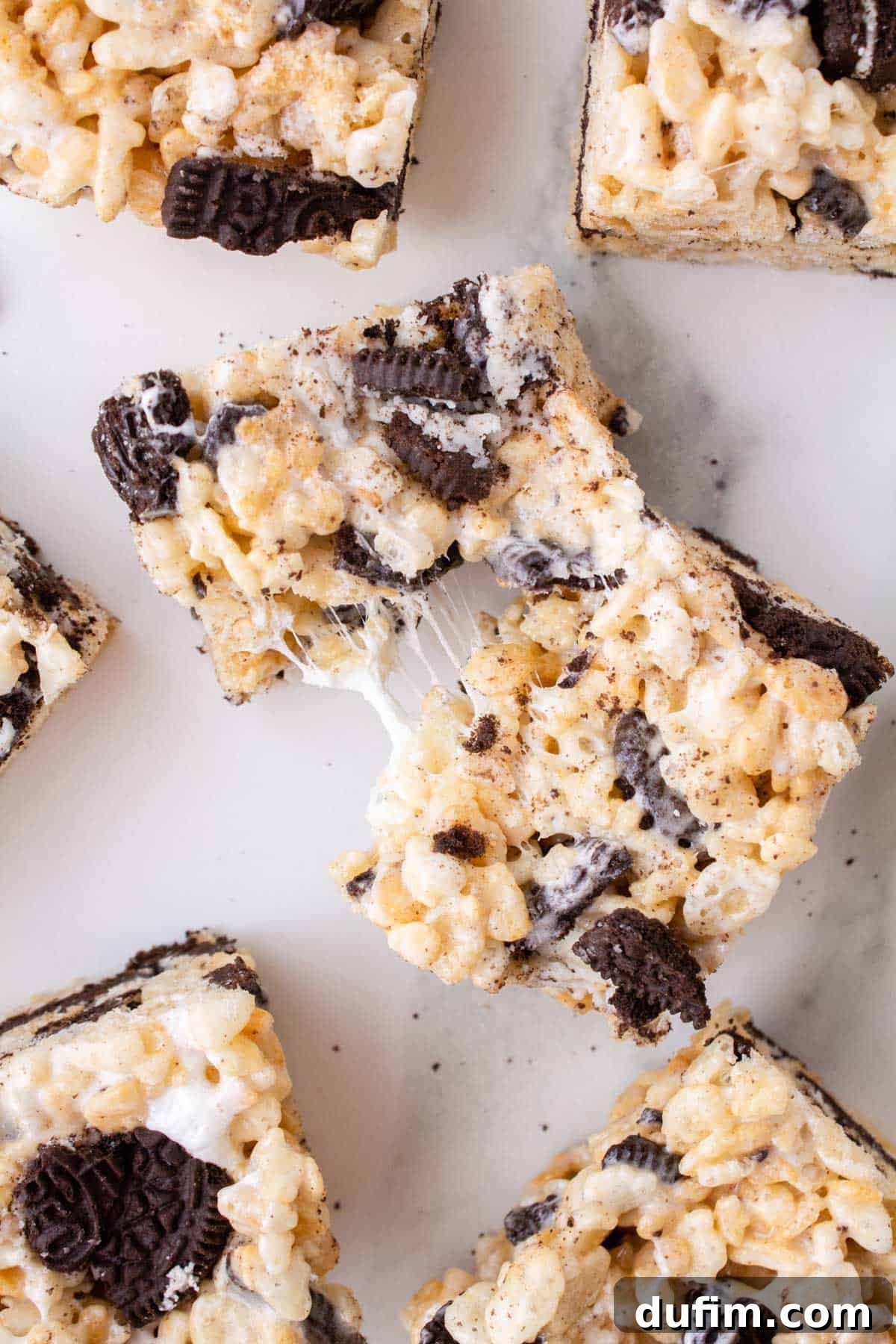 Oreo Dream Krispie Bars 3 a pulled apart oreo rice krispie treat surrounded by more oreo rice krispies
