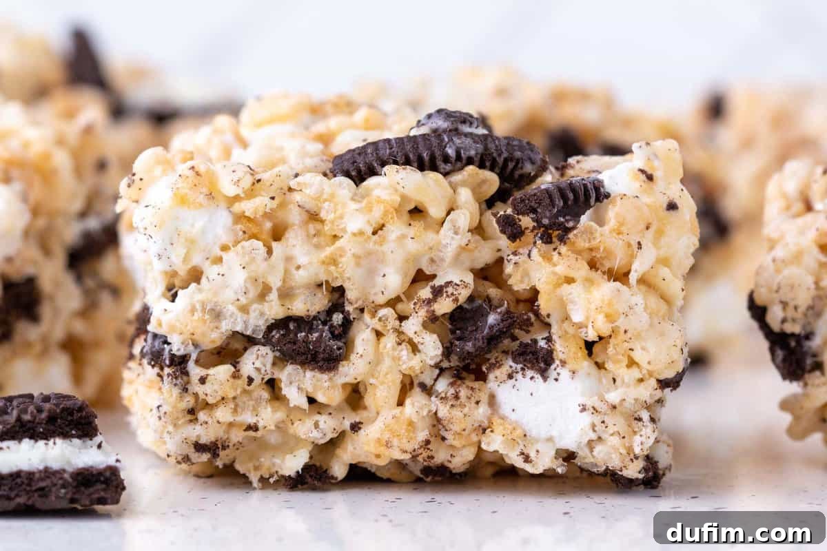 Oreo Dream Krispie Bars 10 close up of a side of an oreo rice krispie treat surrounded by more rice krispie treats in the background