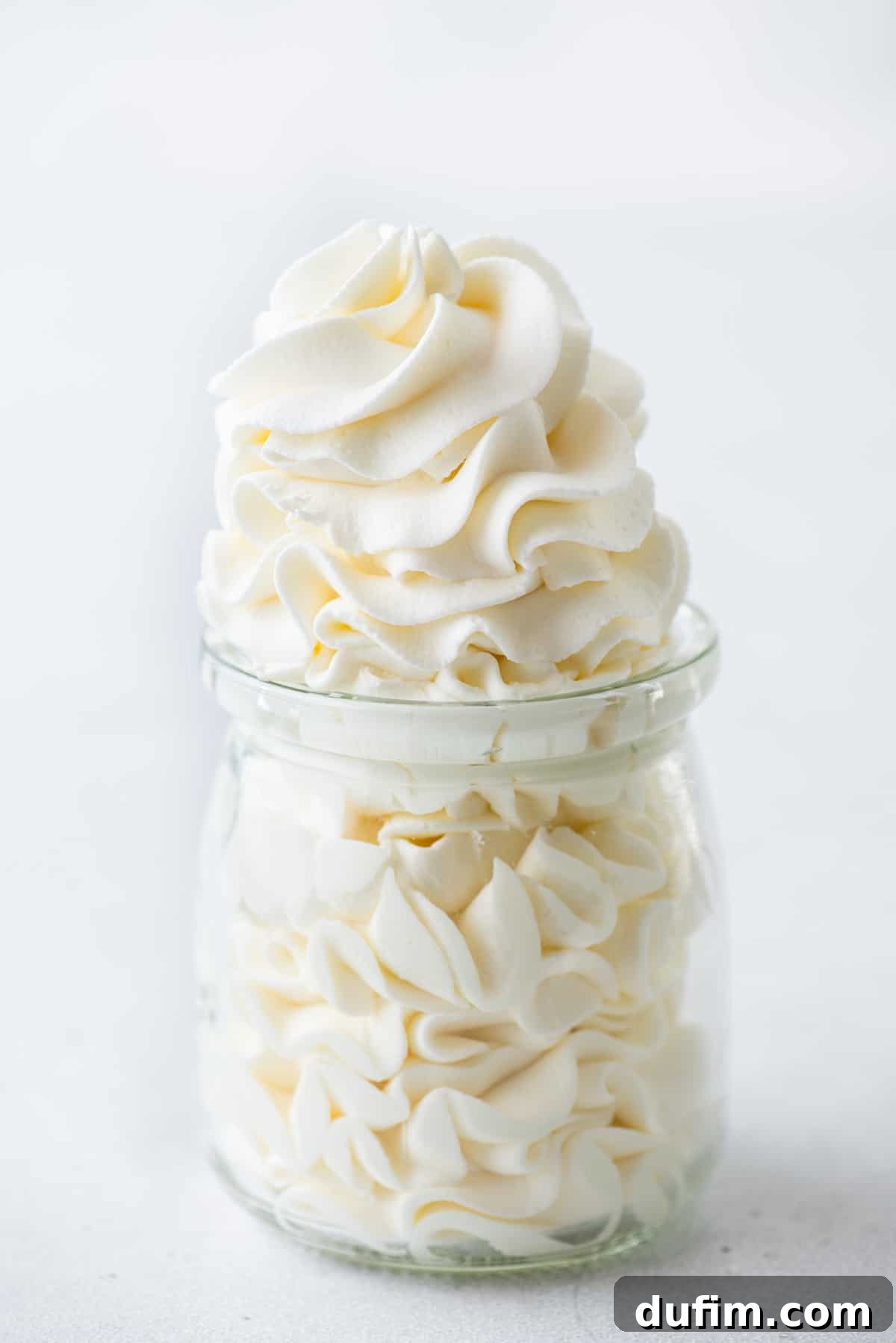 Sweetly Whipped Perfection 2 a glass jar full of homemade fresh whipped cream