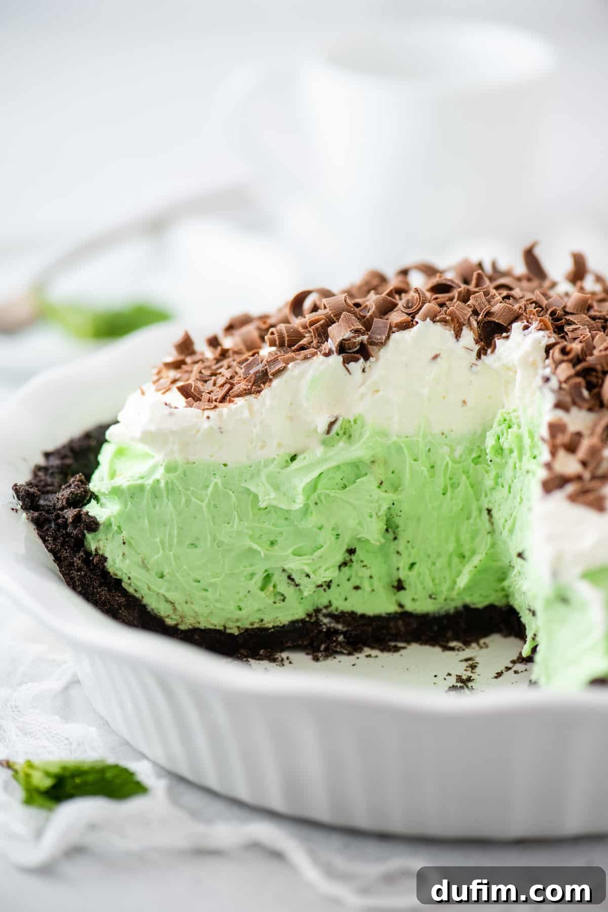 Sweetly Whipped Perfection 12 whipped cream on top of a green pie with chocolate shavings on top
