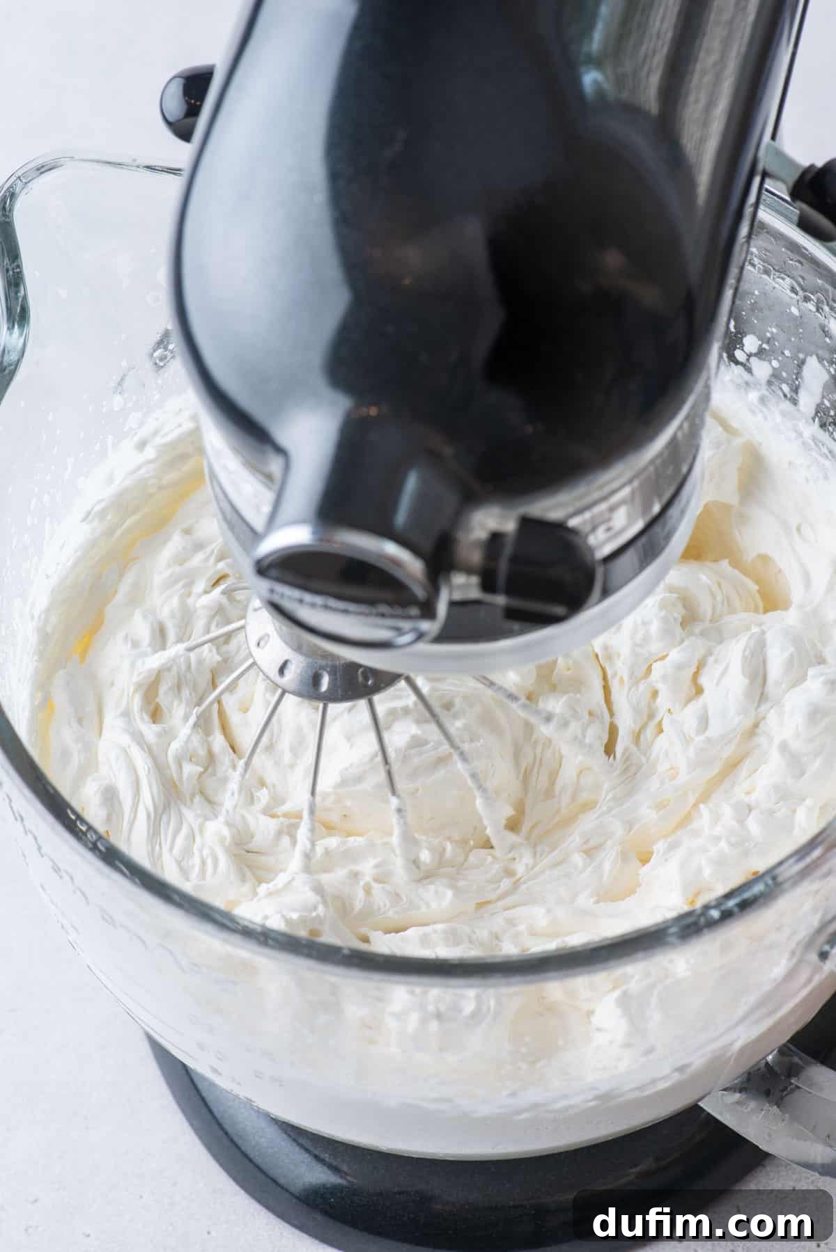 Sweetly Whipped Perfection 13 homemade whipped cream in an electric stand mixer bowl
