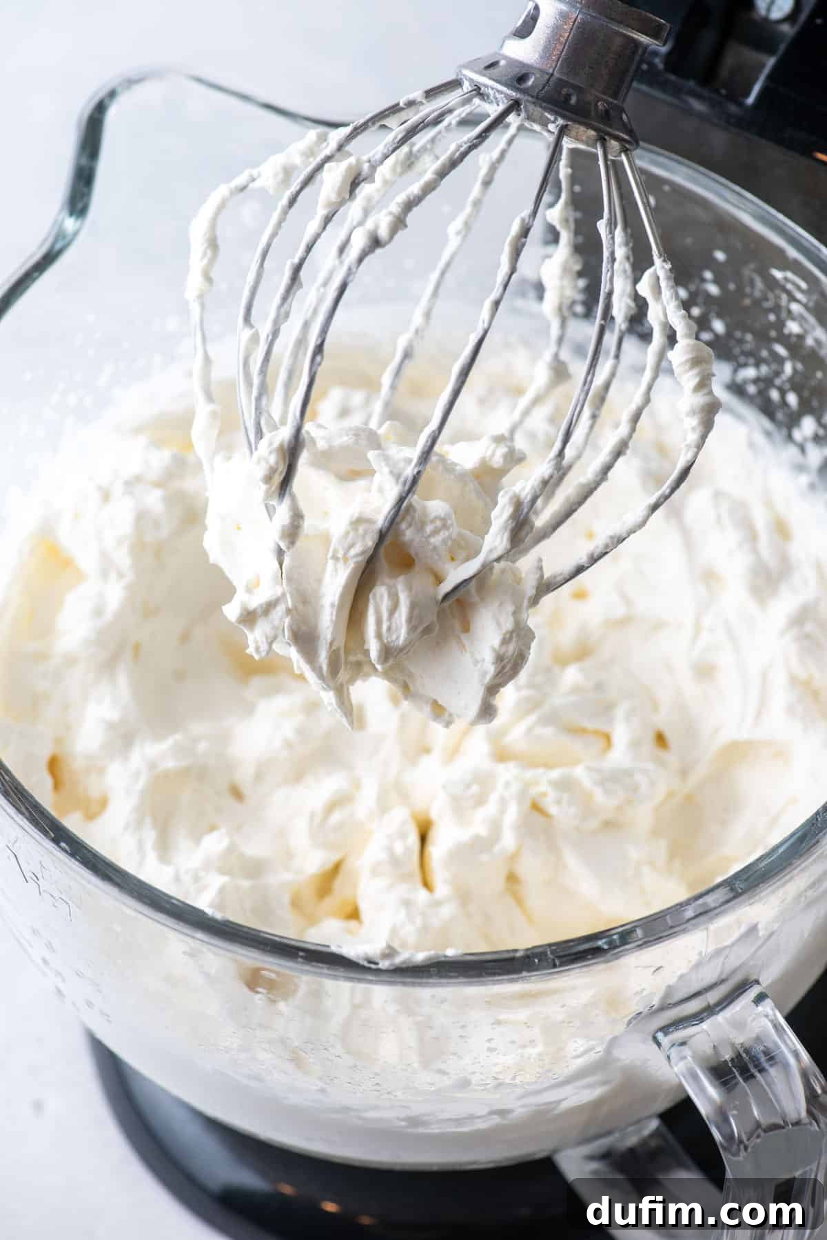 Sweetly Whipped Perfection 7 an electric mixer bowl full of fresh whipped cream