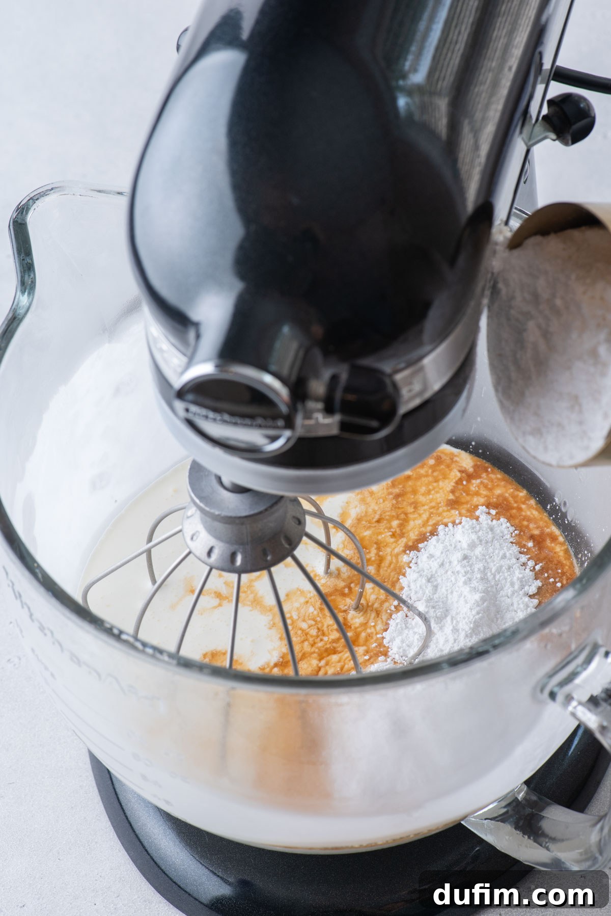 Sweetly Whipped Perfection 9 the ingredients for homemade whipped cream in an electric mixer bowl