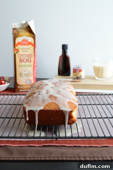 A beautifully glazed Whipped Eggnog Loaf Cake, ready for the holidays.