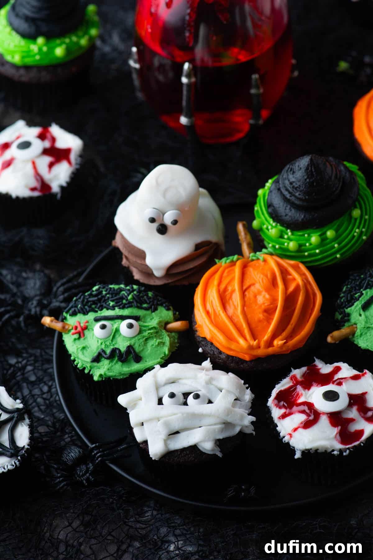 Ghoulishly Good Cupcakes 8 A lovely assortment of Halloween cupcakes, featuring friendly ghost, striking eyeball, classic mummy, cheerful pumpkin, elegant witch hat, and playful spider designs, creating a festive and inviting display.