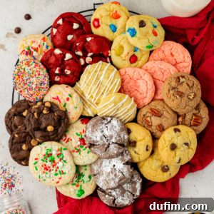 An assortment of delicious cake mix cookies in various flavors arranged in a circle on a wire rack, with sprinkles scattered around, inviting to be tasted.