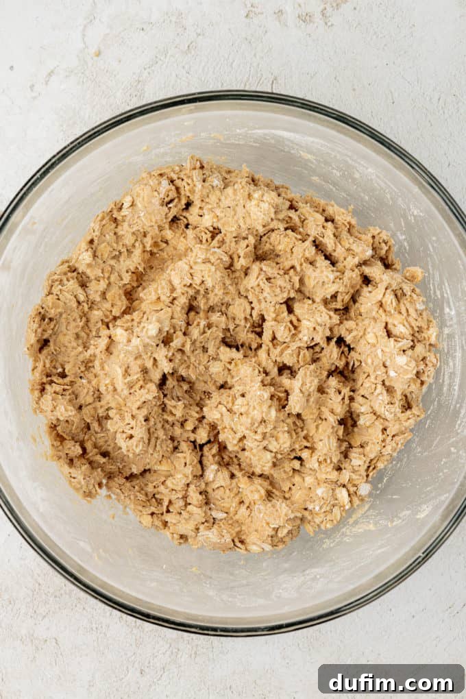 oatmeal cookie dough in a clear glass bowl