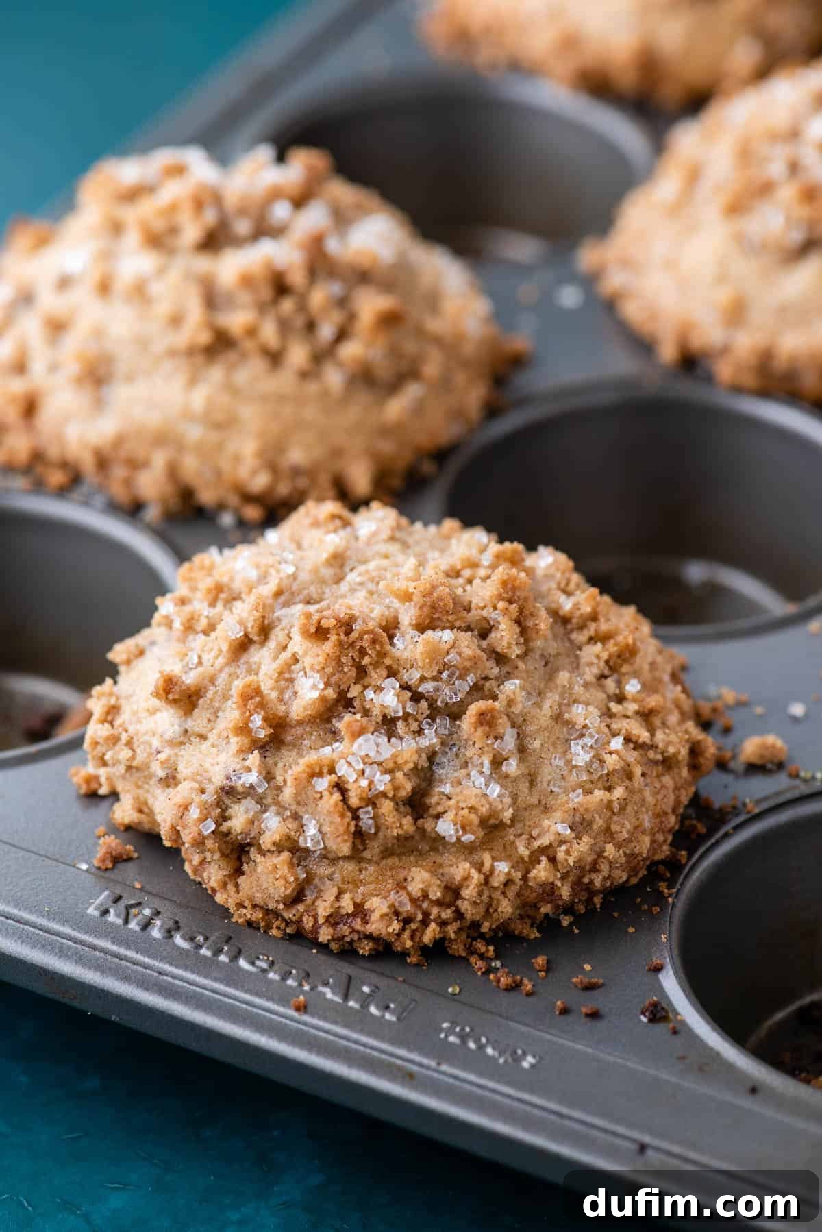 Golden Maple Pecan Muffins 9 A muffin pan showcasing a batch of beautifully baked maple pecan muffins, expertly placed in every other hole. This strategic arrangement ensures optimal doming and even browning, creating perfect bakery-style results.