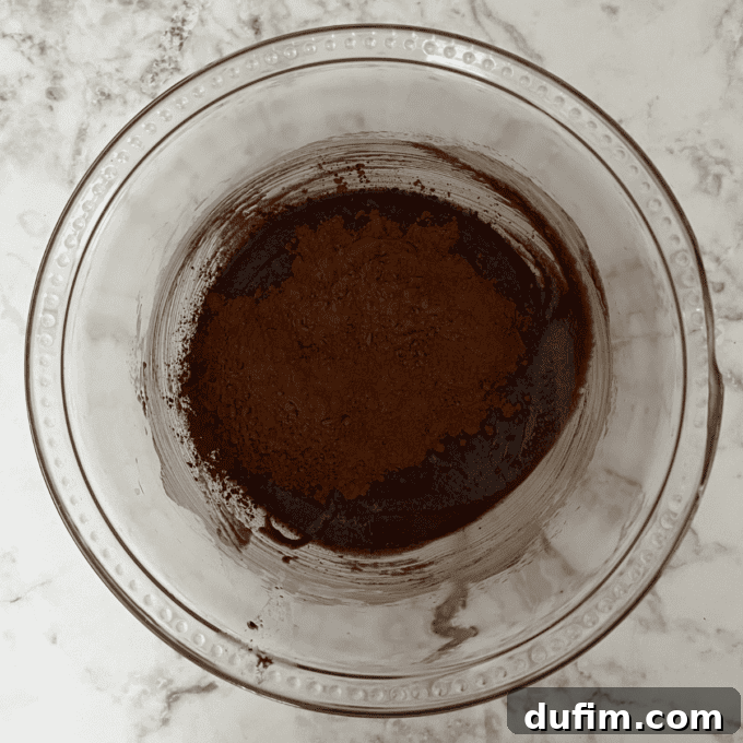 Decadent Flourless Chocolate Cake 11 Chocolate mixture with sugar, salt, and vanilla stirred in