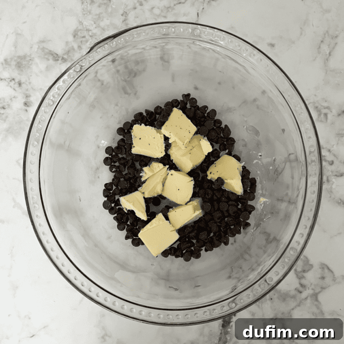 Decadent Flourless Chocolate Cake 8 Melted butter and chocolate chips in a mixing bowl