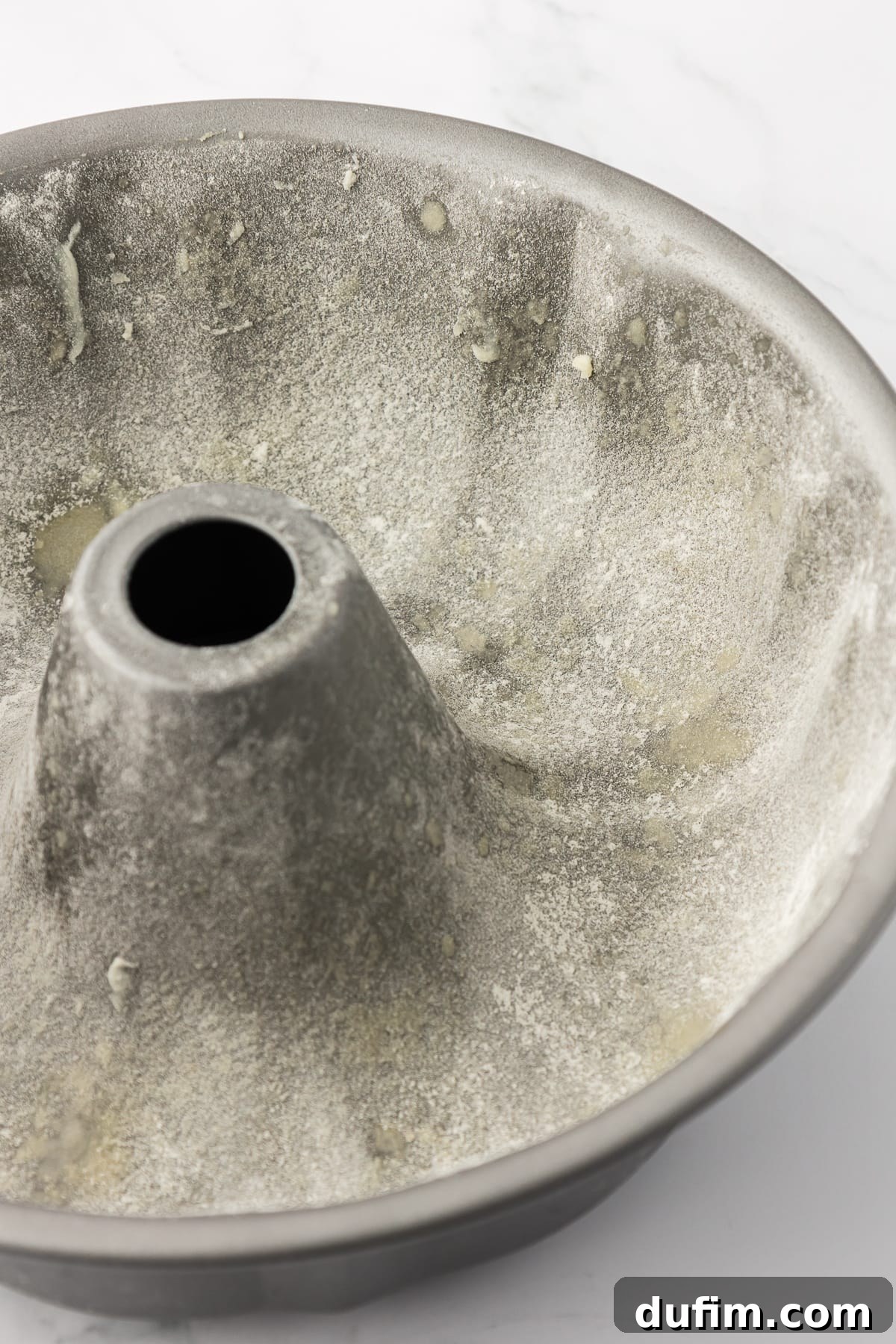 a bundt cake pan coated in butter and a light dusting of flour
