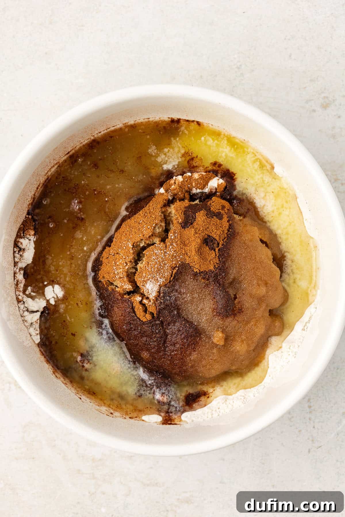 Irresistible Homemade Peach Cobbler 6 Ingredients for the crumble topping for peach cobbler, including flour, brown sugar, cinnamon, and salt, presented in a small white bowl.