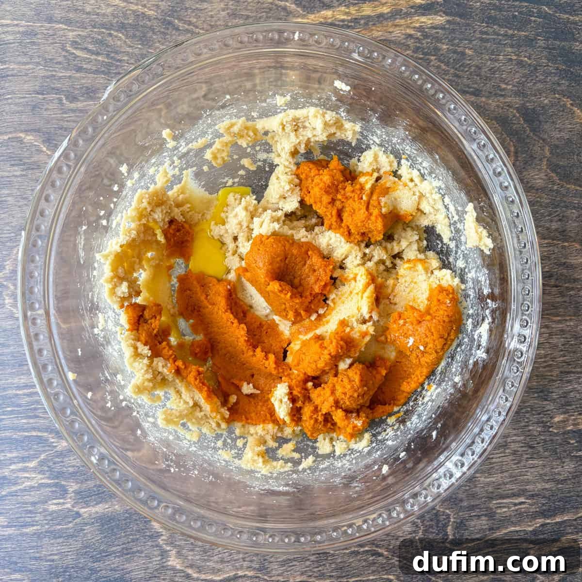 Cozy Autumn Pumpkin Spice Cookies 8 pumpkin puree and other cookie dough ingredients in a clear glass bowl
