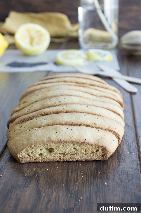 Lemon Poppy Seed Biscotti loaf before slicing, showcasing its perfect bake.