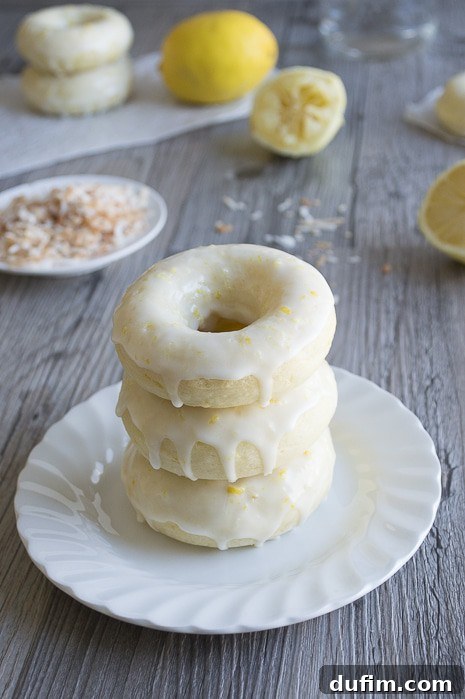Close-up of a glazed Lemon Coconut Donut, showcasing its inviting texture