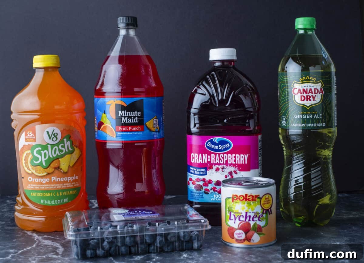 Assorted beverages and fruits including a V8 Splash Orange Pineapple juice, Minute Maid Fruit Punch, Ocean Spray Cran-Raspberry juice, Canada Dry Ginger Ale, blueberries, and a can of Polar lychee.