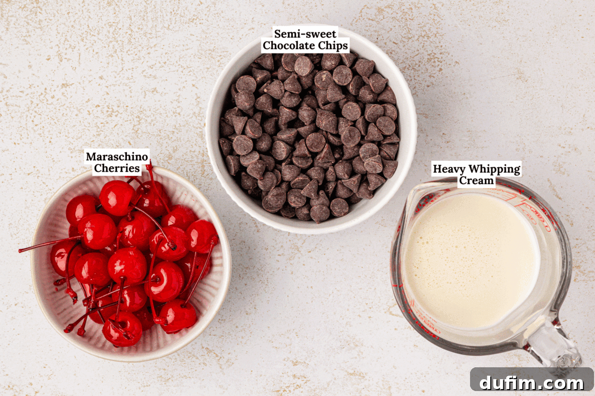 A selection of key ingredients for Black Forest Thumbprint Cookies, including a bowl of bright red maraschino cherries, a bowl of semi-sweet chocolate chips, and a measuring cup of heavy whipping cream, artfully arranged on a light surface.