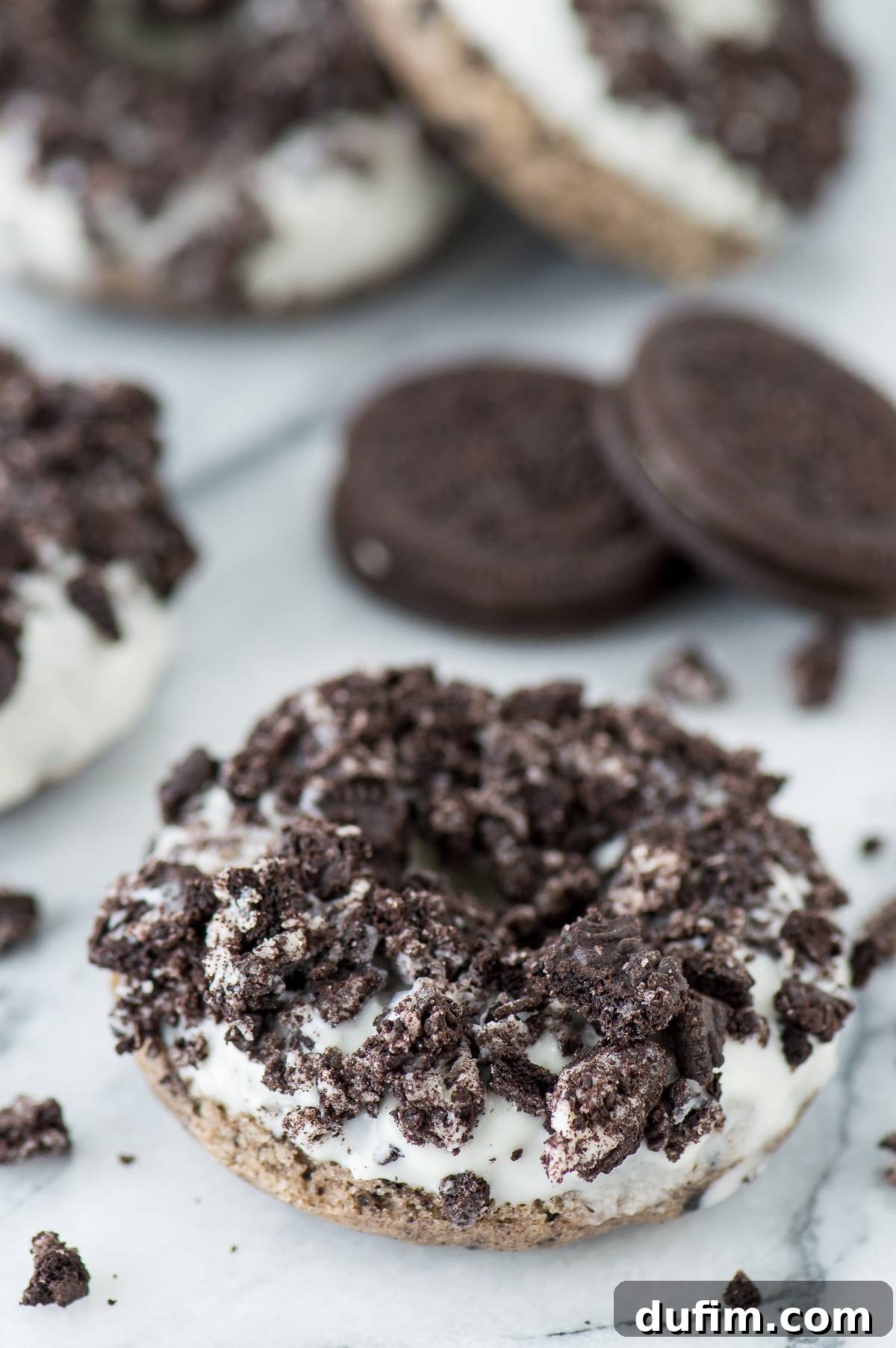 Several Oreo Overload Donuts arranged beautifully on a white platter, ready to be served.