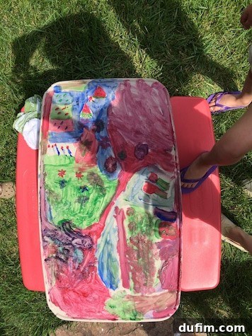 Finger painting with nanny kiddos, creating vibrant and colorful art