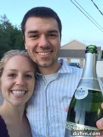 Ryan enthusiastically popping a bottle of champagne for their first Fancy Friday celebration
