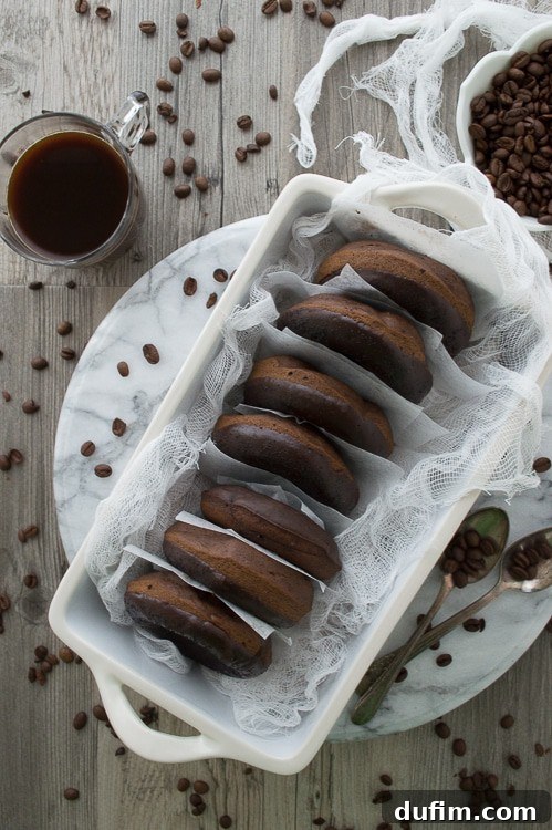 Brewed and Baked Bliss 3 A close-up shot of a single glazed coffee donut, showcasing its perfect texture and tempting chocolate-coffee glaze, nestled among fresh coffee beans.