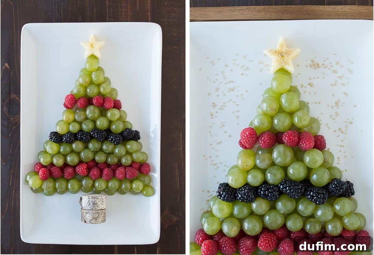 A close-up view of the Christmas tree fruit platter, showcasing the rich texture of the grapes, raspberries, and blackberries, with gold sprinkles shimmering on the apple star.
