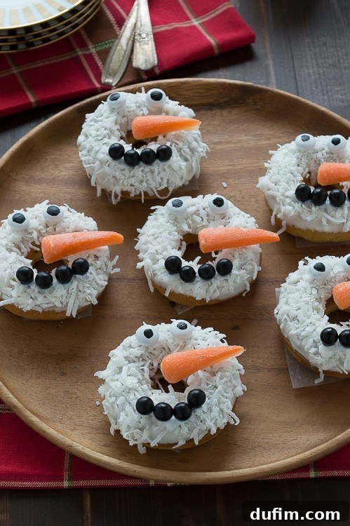 A plate of freshly made caramel coconut snowmen donuts, ready to be enjoyed as a holiday treat.