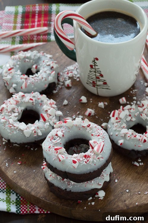 Holiday Chocolate Peppermint Donuts 2 Baked chocolate donuts infused with peppermint flavor, topped with white chocolate and crushed candy canes.