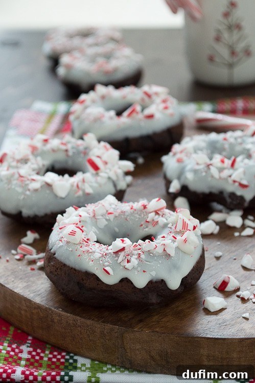Holiday Chocolate Peppermint Donuts 3 Baked chocolate donuts infused with peppermint flavor, topped with white chocolate and crushed candy canes.