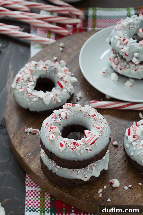 Holiday Chocolate Peppermint Donuts 4 Baked chocolate donuts infused with peppermint flavor, topped with white chocolate and crushed candy canes.