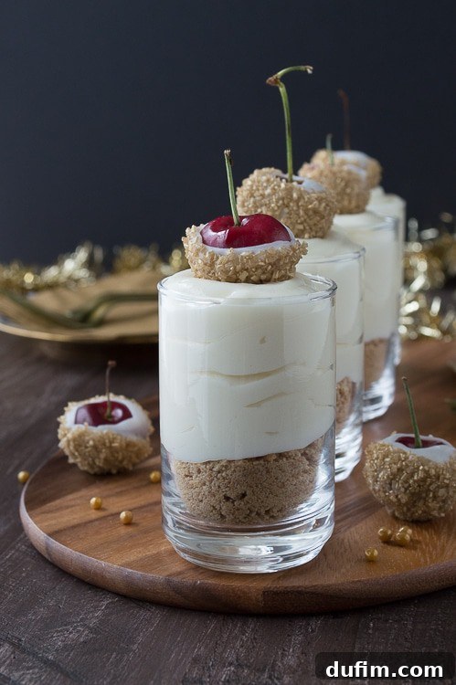 Make these fancy and easy white chocolate champagne cheesecake shooters for New Years Eve! I LOVE the cherries dipped in gold sprinkles! 