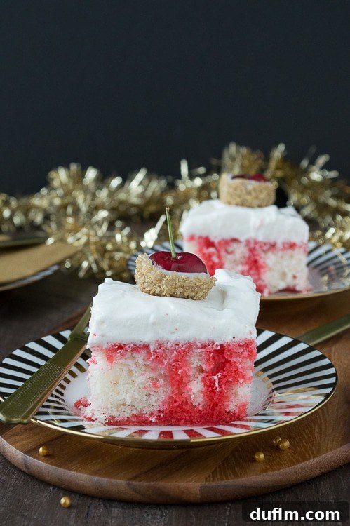 A festive Champagne Cherry Poke Cake, infused with sparkling champagne and vibrant cherry, topped with whipped cream and white chocolate-dipped cherries covered in gold glitter. Perfect for New Year’s Eve celebrations.