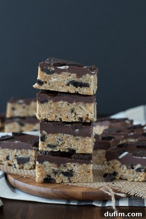 Decadent Oreo Scotcheroo Bars 5 Individual Oreo Scotcheroo bar, close-up on the texture of the base and chocolate topping.
