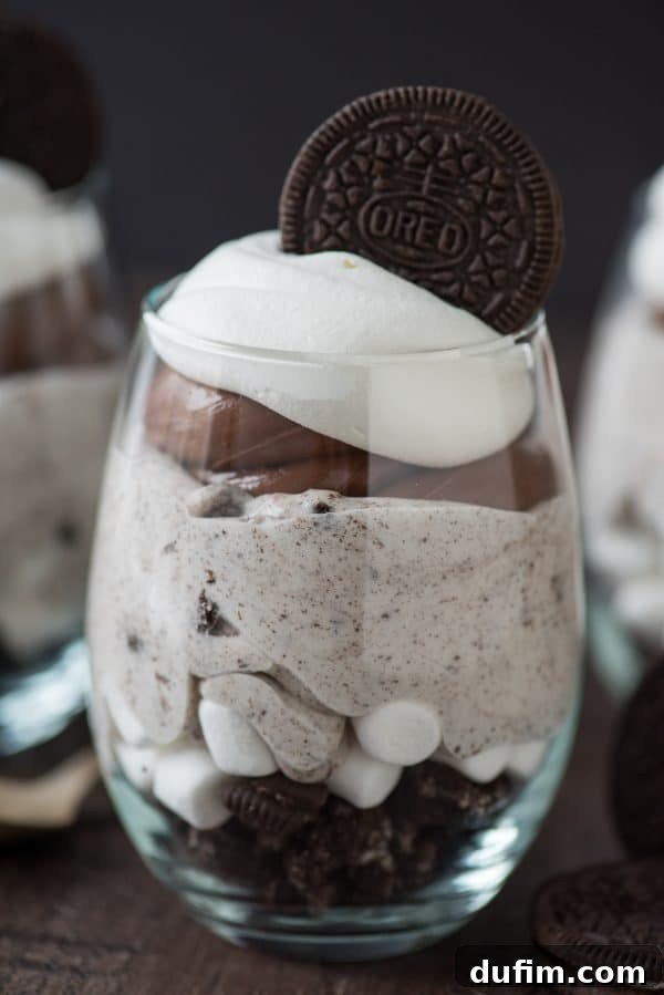 Over the Top Chocolate Cheesecake Oreo Parfaits - layers of chocolate, cheesecake, and Oreos