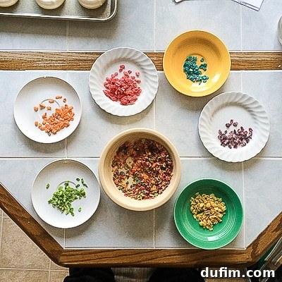A close-up shot of Fruity Pebbles cereal being meticulously sorted into individual piles by color, showcasing the vibrant spectrum of the cereal.