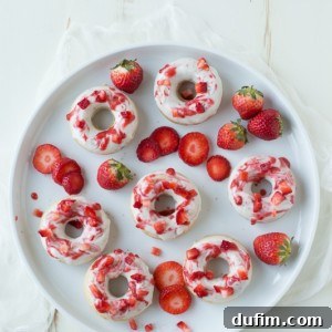 Strawberry Cheesecake Donut Delights 6 Final plated Strawberry Cheesecake Donuts with glaze and coulis