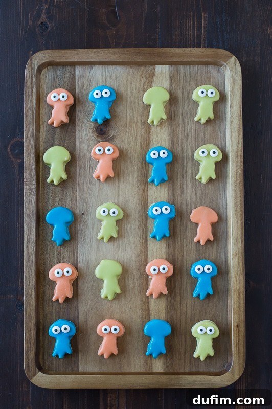 Jellyfish Oreo Balls in various pastel colors arranged on a white serving dish.