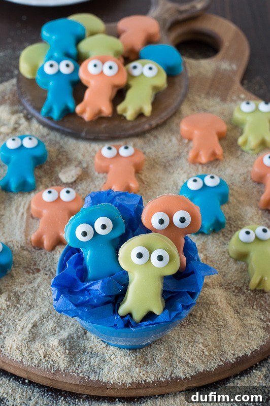 A close-up of a blue Jellyfish Oreo Ball with candy eyes, showcasing its intricate details.