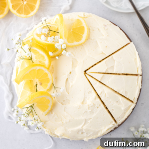 Overhead view of round lemon cake with three slices cut
