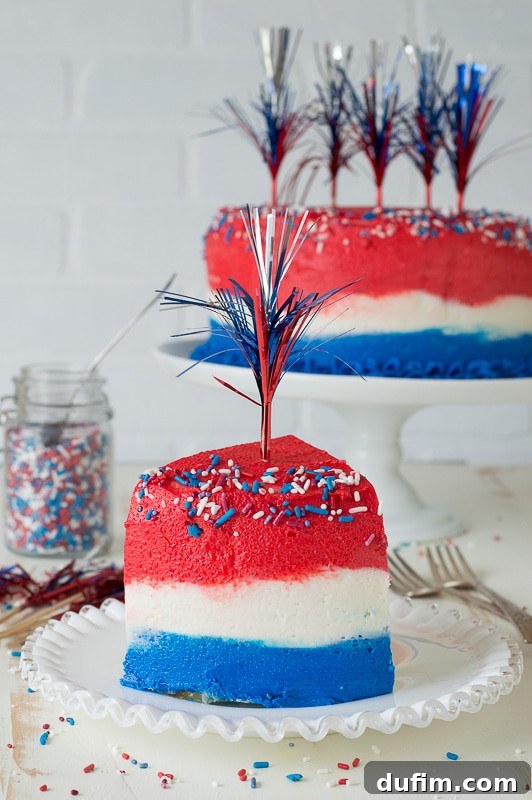 Close-up of the red, white, and blue ombre frosting on a 4th of July cake, showcasing smooth blends of color.