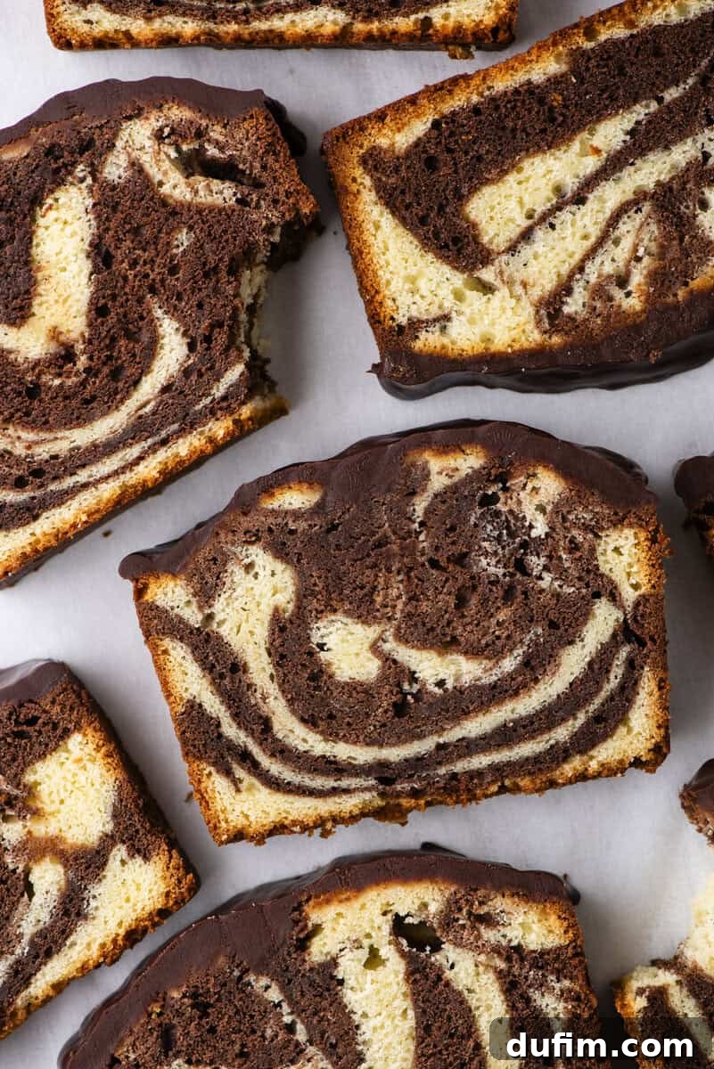 A close-up shot revealing the exquisite texture and subtle sheen of a perfectly baked pound cake, hinting at its rich and moist interior.