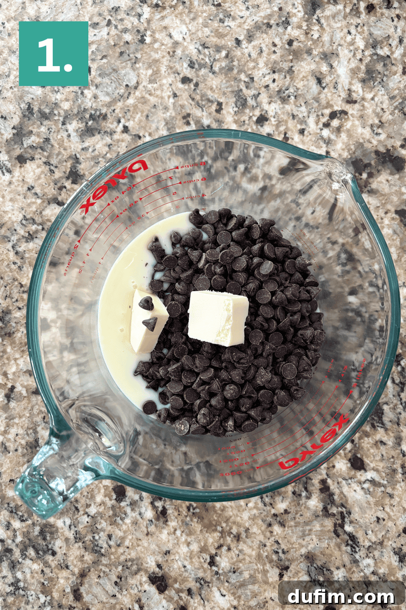 Decadent Chocolate Peanut Butter Fudge 6 A glass measuring cup on a granite countertop contains chocolate chips, two chunks of butter, and sweetened condensed milk. A green box with a white number 1 is in the top left corner.