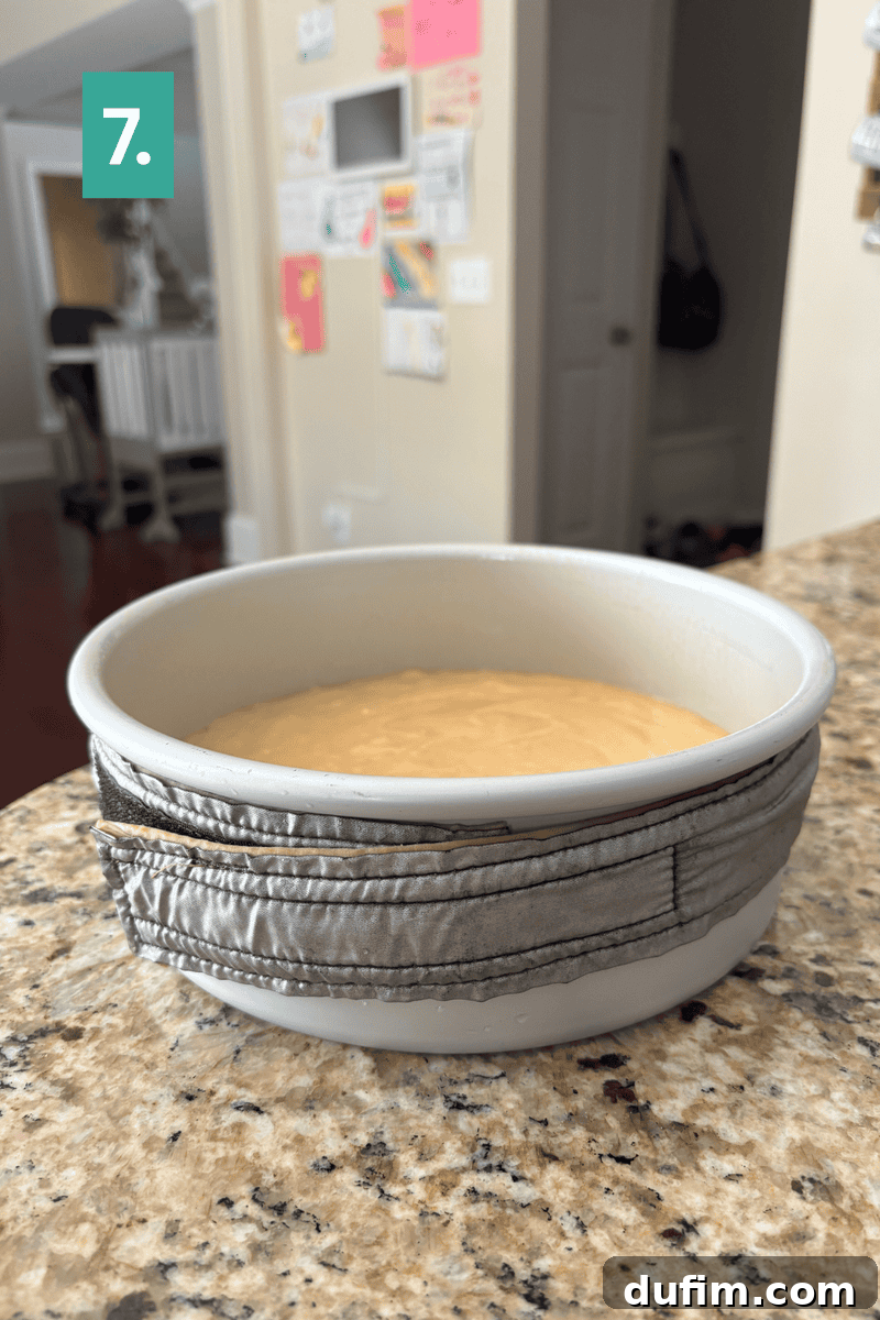 Peanut Butter Cake with Chocolate Frosting Recipe 11 A bowl with batter sits on a granite counter.