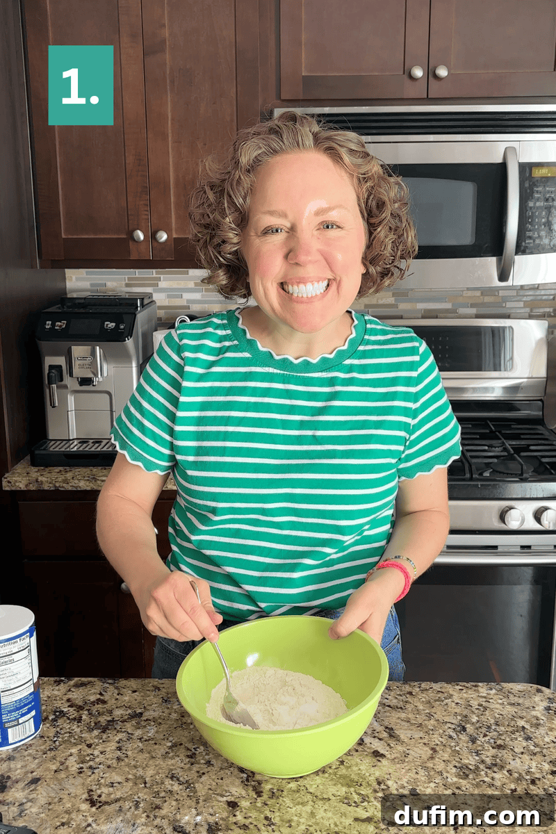 Peanut Butter Cake with Chocolate Frosting Recipe 7 Smiling person in a green striped shirt mixes flour in a green bowl on a kitchen counter.